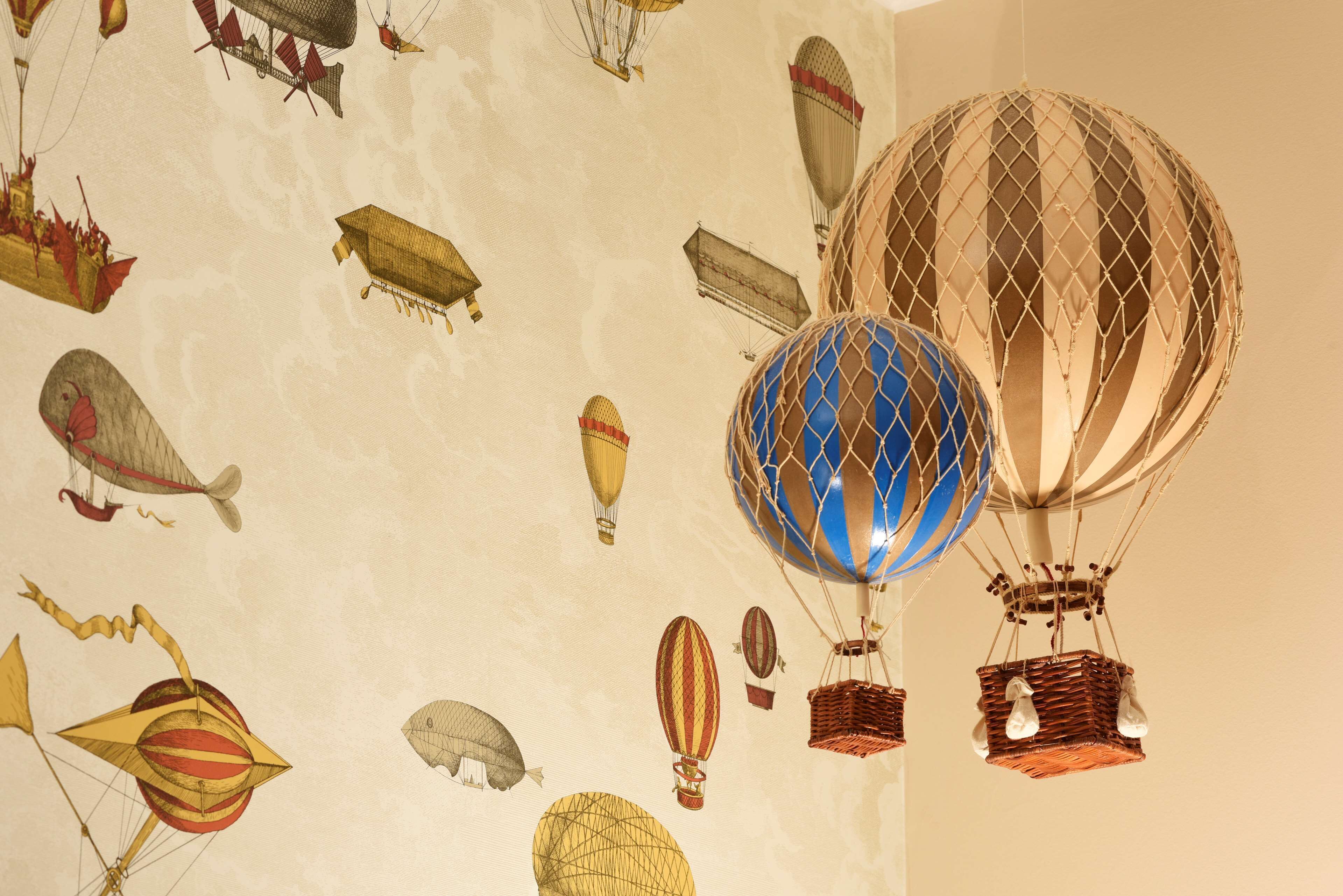 A ceiling with various hot air balloon designs.