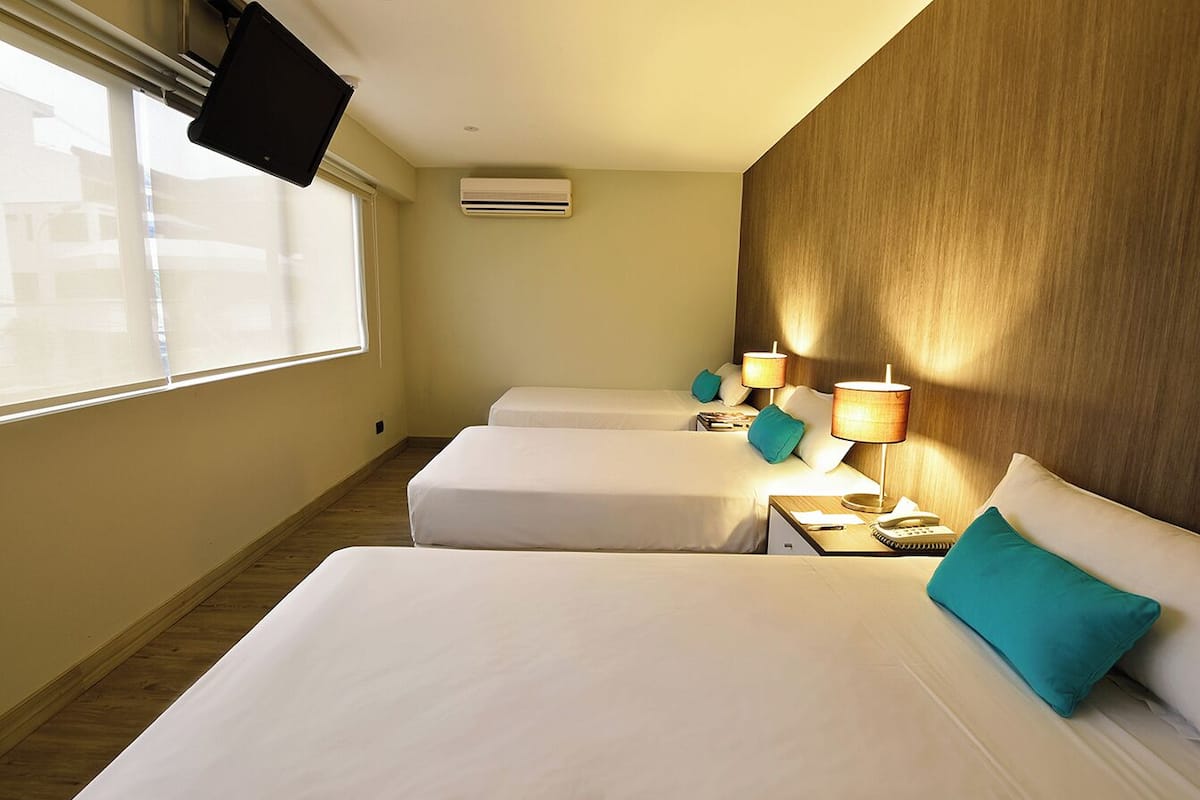 Triple Room, City View | Premium bedding, down comforters, minibar, in-room safe