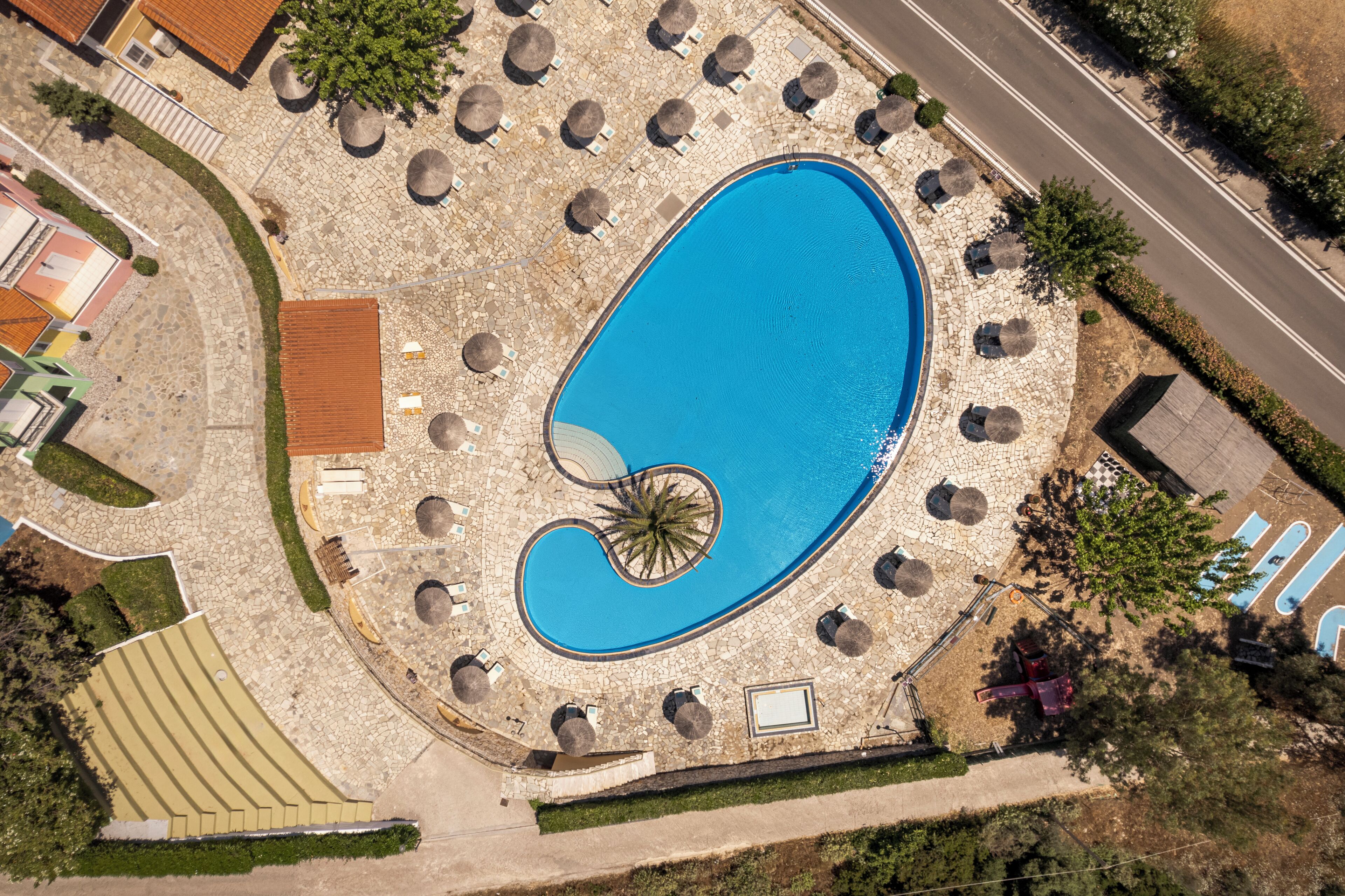 Seasonal outdoor pool, open 8 AM to 8 PM, pool umbrellas