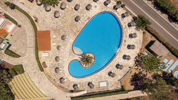 Seasonal outdoor pool, open 8 AM to 8 PM, pool umbrellas