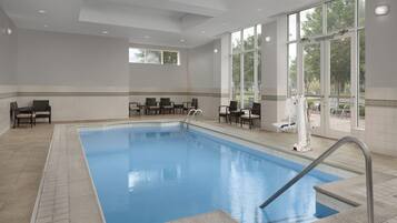 Indoor pool, open 8:00 AM to 10:00 PM, pool loungers
