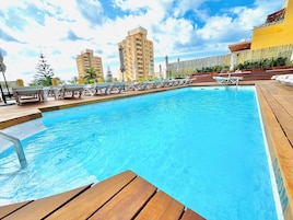 Outdoor pool, pool umbrellas, sun loungers
