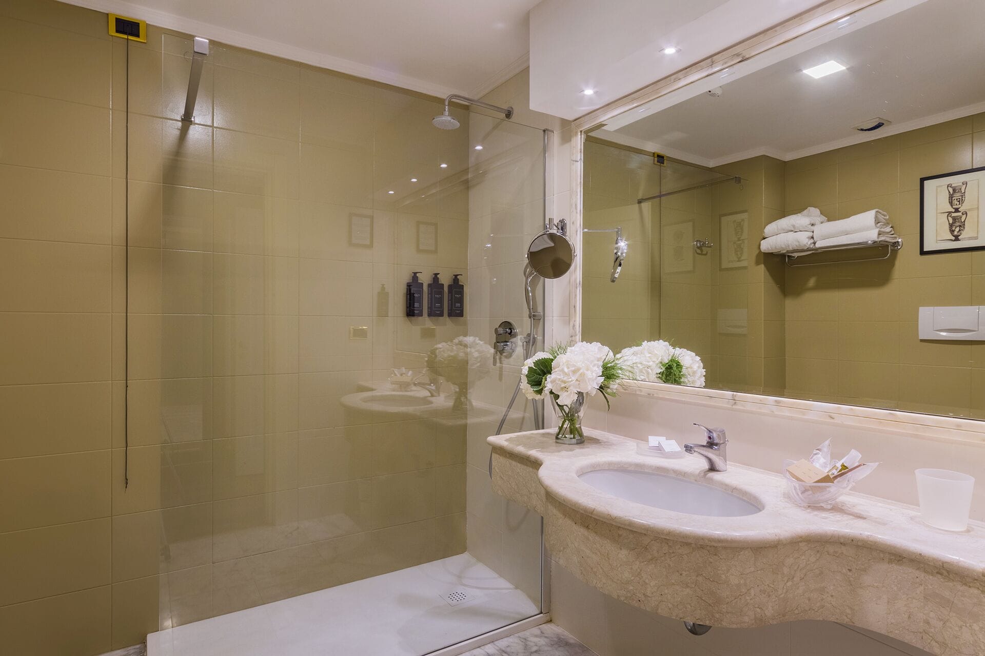 designer toiletries, hair dryer, slippers, bidet