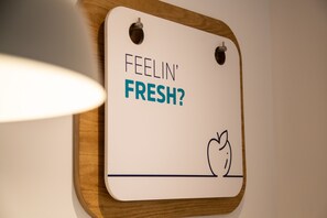 A sign with the text "FEELIN' FRESH?" and a drawing of an apple. - Holiday Inn Express London Stansted Airport by IHG (Bishop's Stortford)