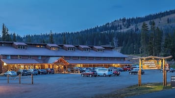 Experience the rustic charm of Togwetee Mountain Lodge, offering horse rides and a scenic forest backdrop.