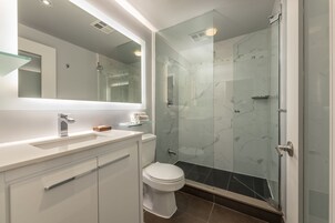 Shower, rainfall showerhead, designer toiletries, hair dryer