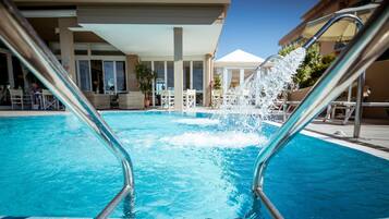 Seasonal outdoor pool, pool umbrellas, pool loungers