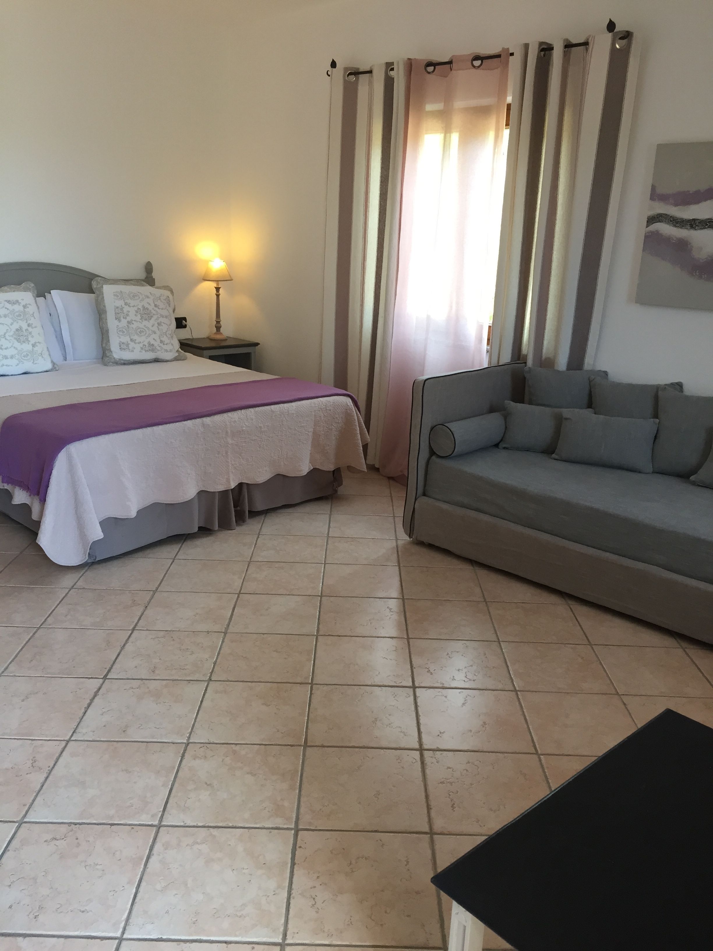 junior suite | minibar, in-room safe, desk, bed sheets