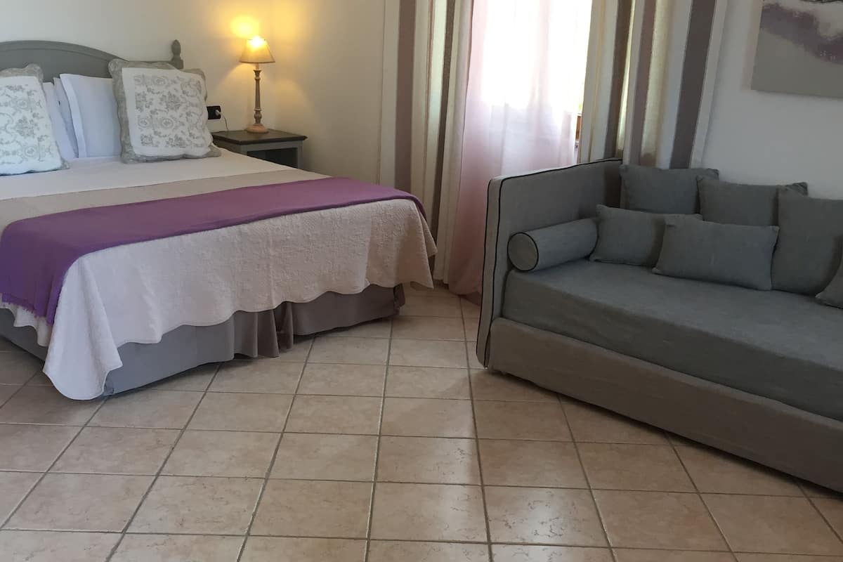 junior suite | minibar, in-room safe, desk, bed sheets