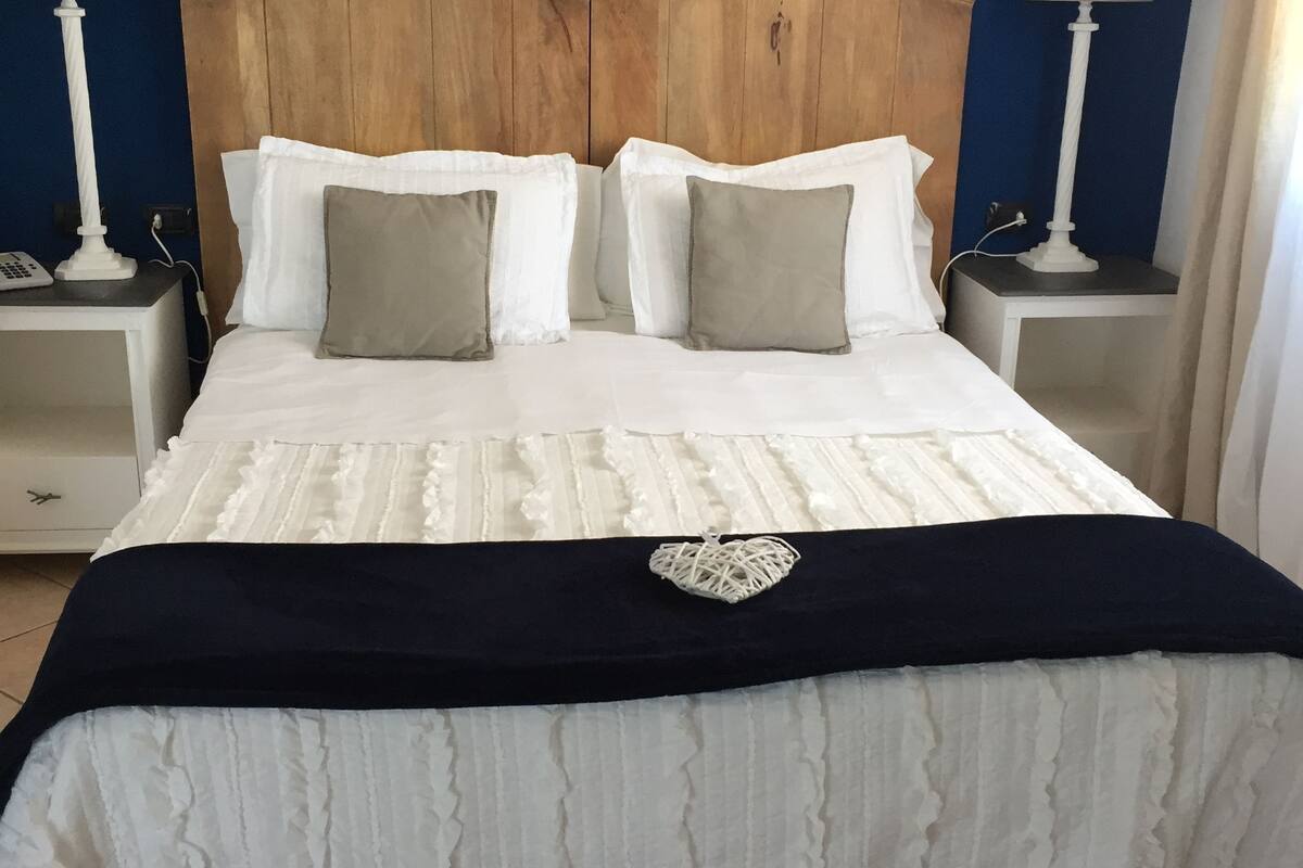 junior suite | minibar, in-room safe, desk, bed sheets