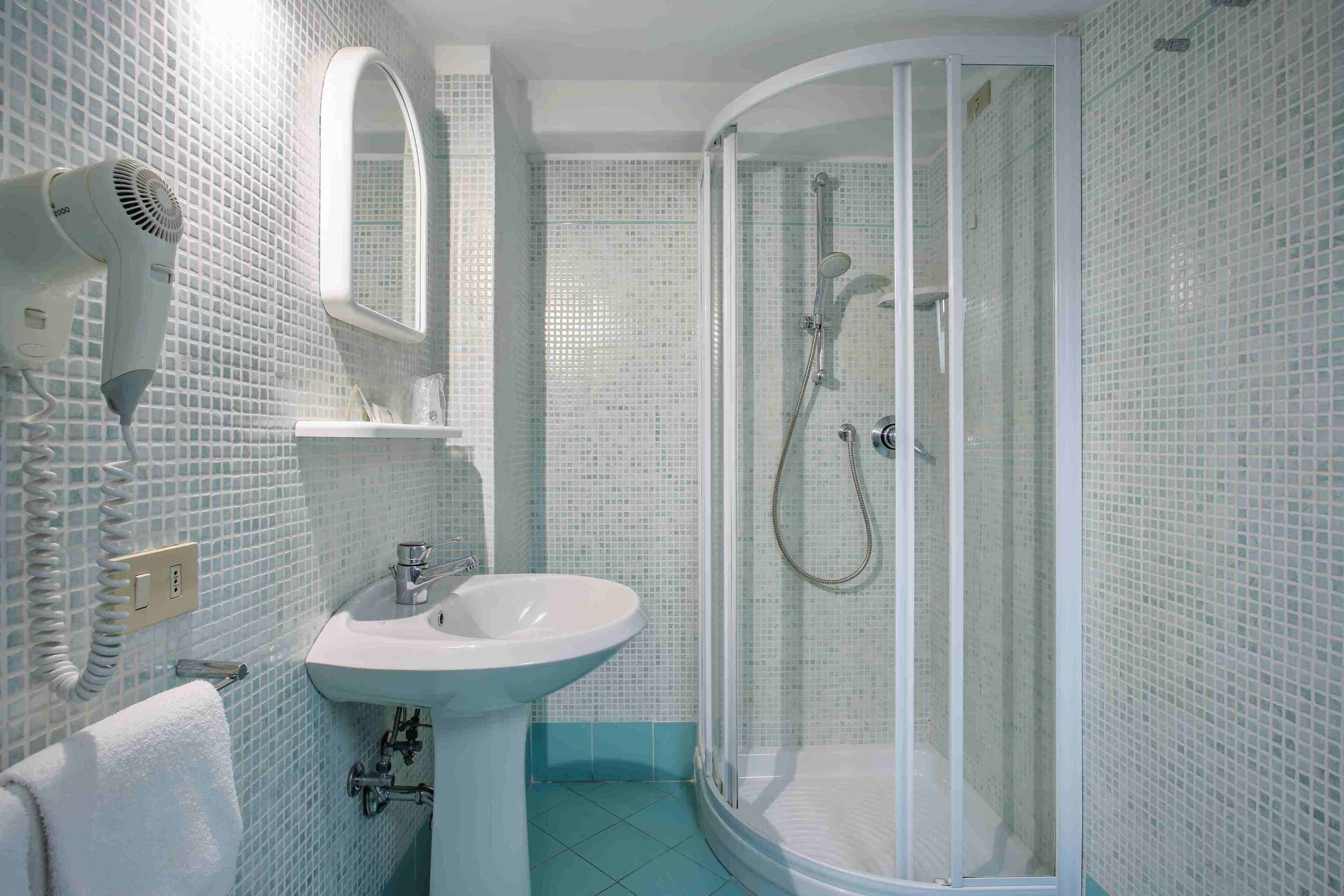 economy double or twin room (attic) | bathroom | shower, eco-friendly toiletries, hair dryer, towels