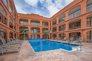 Seasonal outdoor pool, open 9 AM to 9 PM, pool loungers