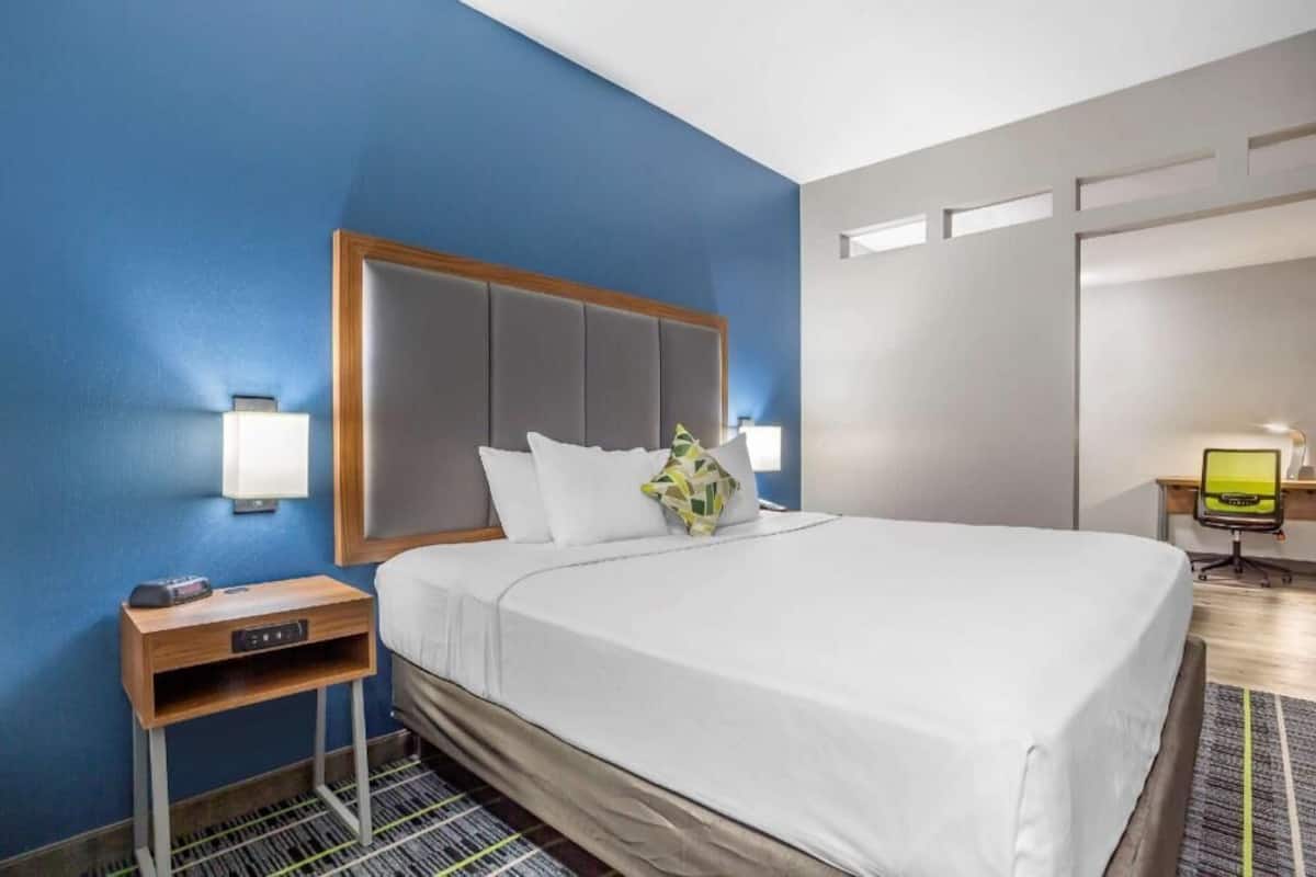 Premium bedding, desk, laptop workspace, blackout curtains
