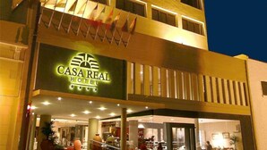 The exterior of Casa Real Hotel with a prominent sign, multiple windows, and a visible entrance. - Casa Real (Salta)