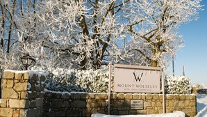 A stone wall with a sign for Mount Wolseley Hotel, SPA & Country Club. - Mount Wolseley Hotel, Golf and Spa Resort (Tullow)