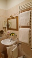 Shower, rainfall showerhead, free toiletries, hair dryer