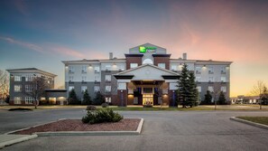 A Holiday Inn Express hotel with a symmetrical facade, multiple windows, and a central entrance.