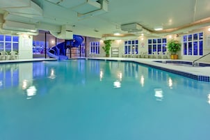 Indoor pool, open 8:00 AM to 10:00 PM, pool loungers