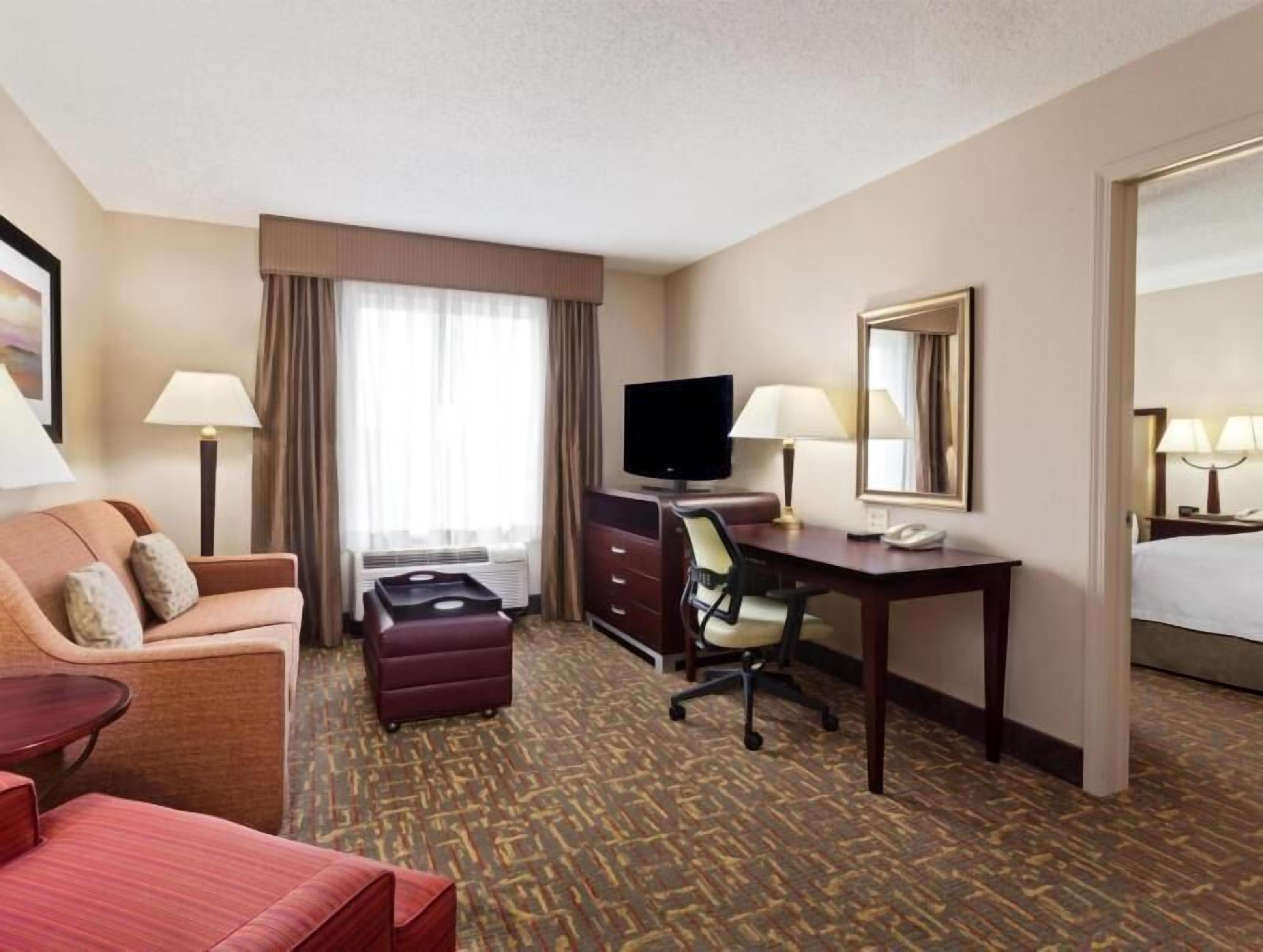 Premium bedding, desk, laptop workspace, iron/ironing board