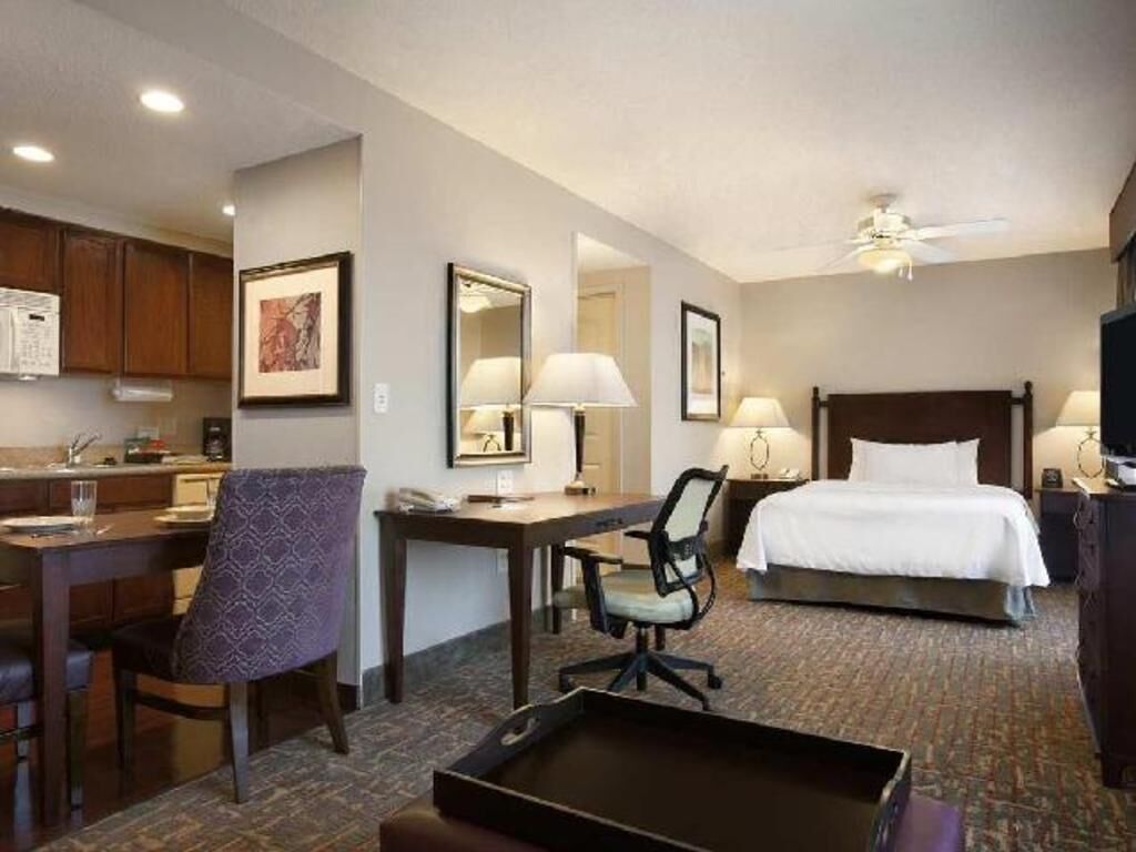 Premium bedding, desk, laptop workspace, iron/ironing board