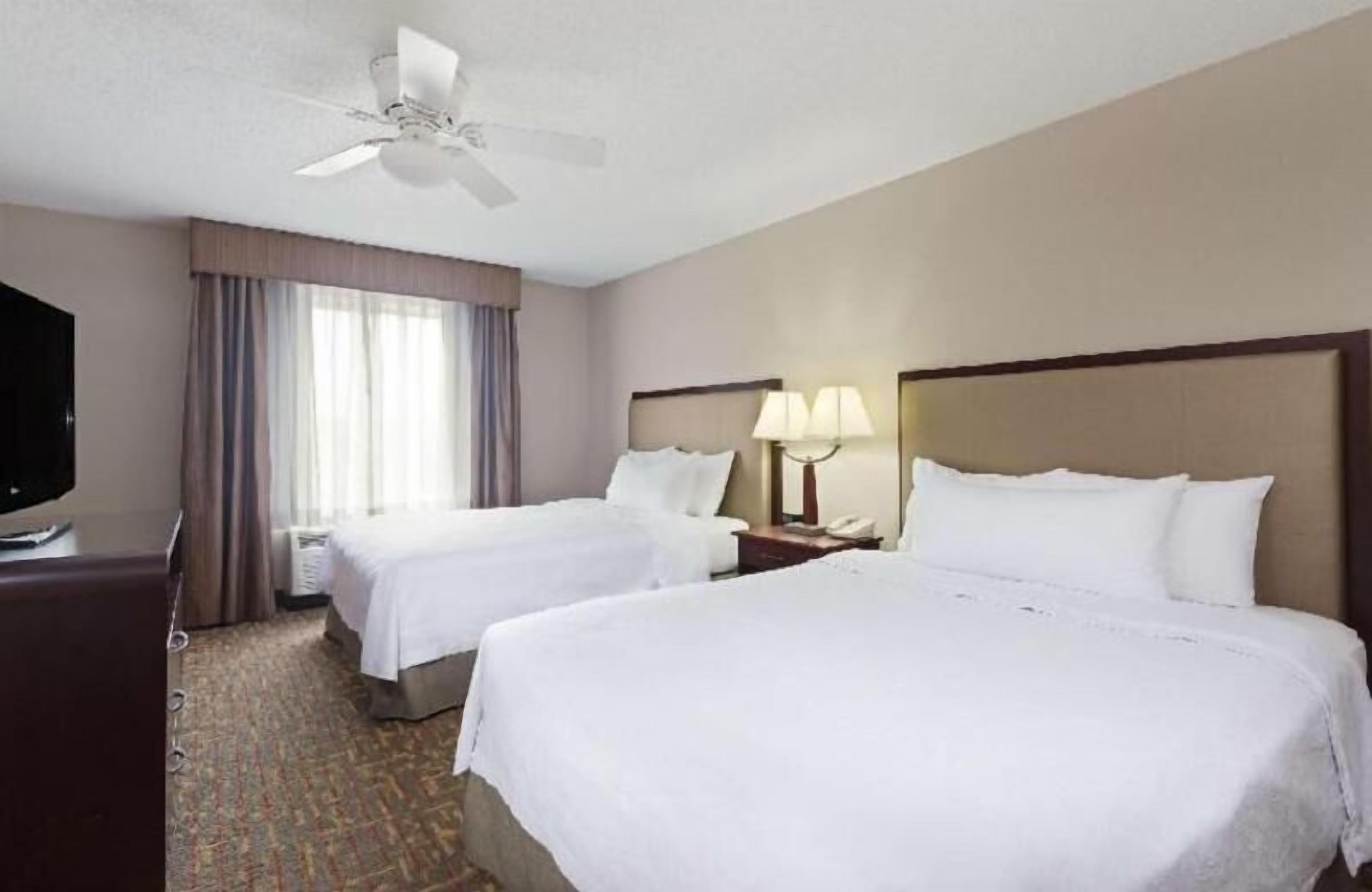 Premium bedding, desk, laptop workspace, iron/ironing board