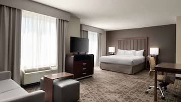 Premium bedding, desk, laptop workspace, iron/ironing board
