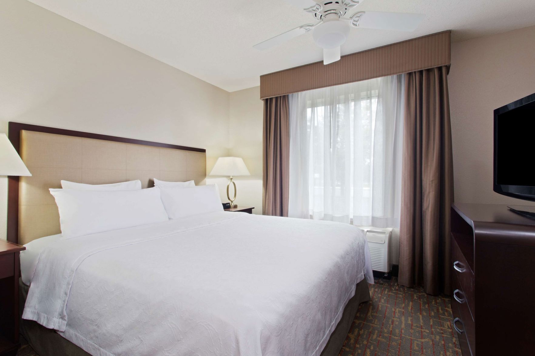 Premium bedding, desk, laptop workspace, iron/ironing board