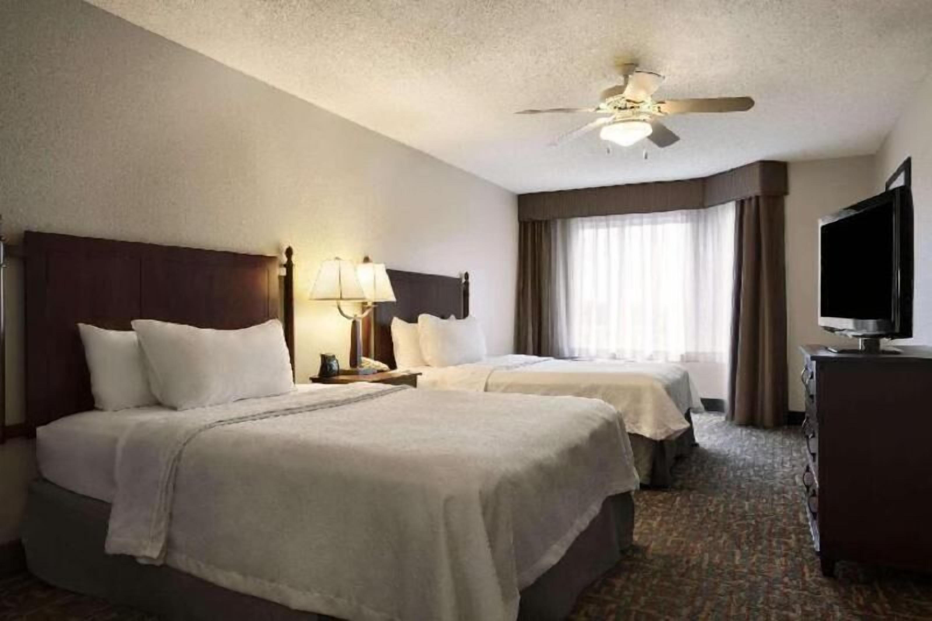 Premium bedding, desk, laptop workspace, iron/ironing board