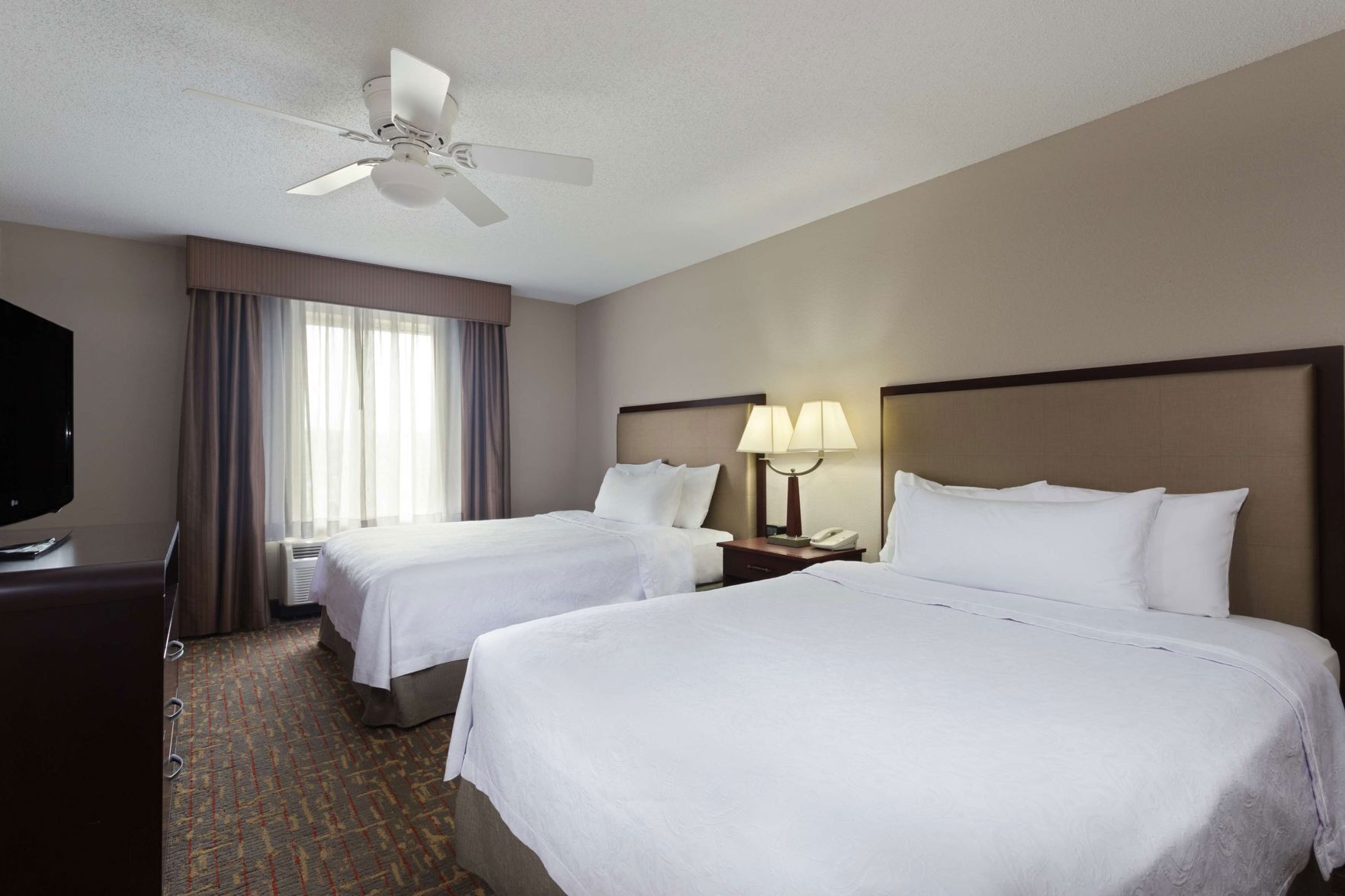 Premium bedding, desk, laptop workspace, iron/ironing board