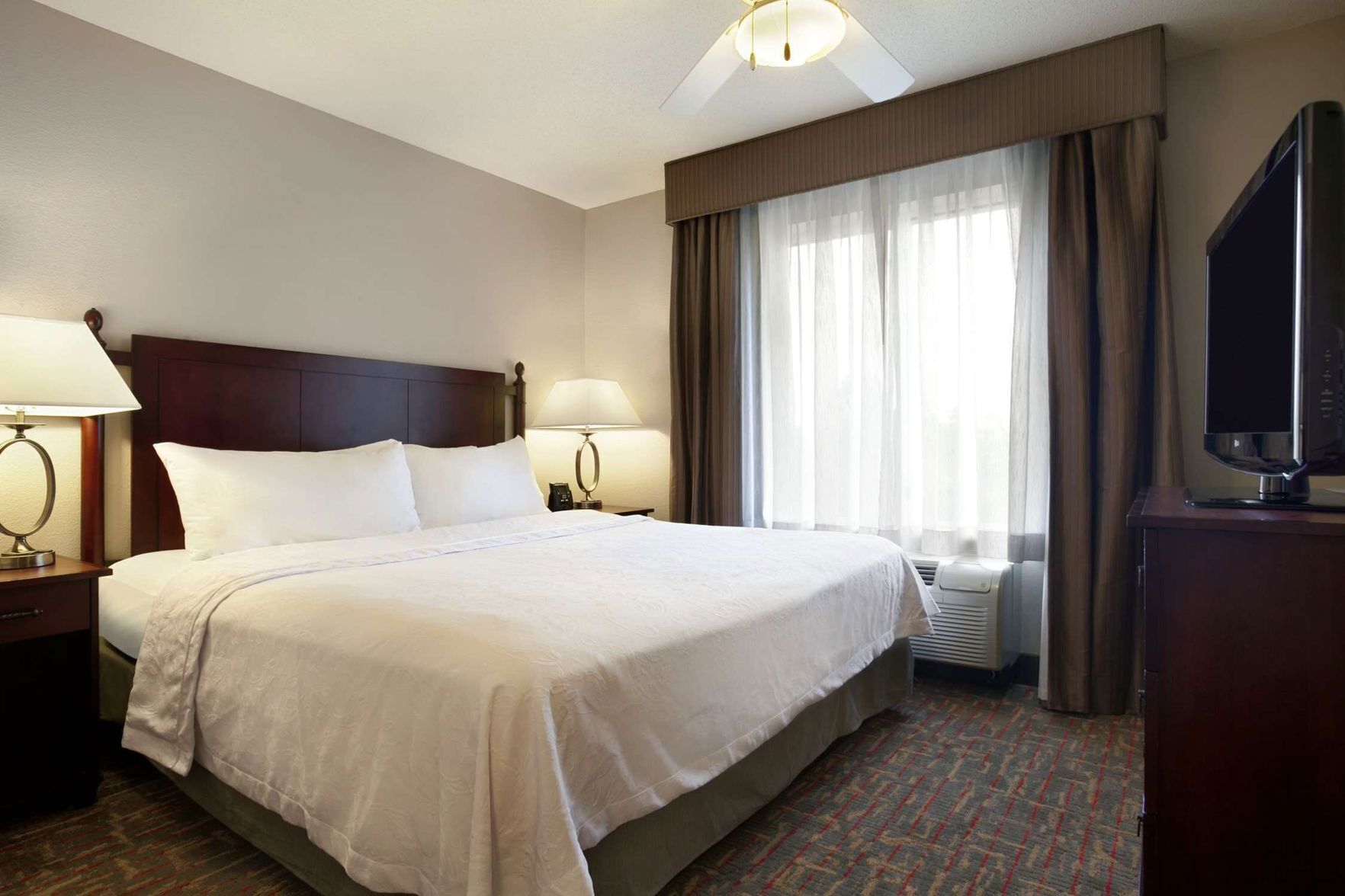 Premium bedding, desk, laptop workspace, iron/ironing board