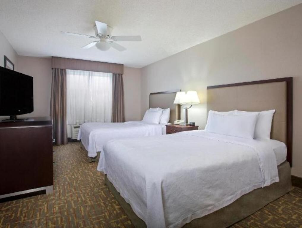 Premium bedding, desk, laptop workspace, iron/ironing board
