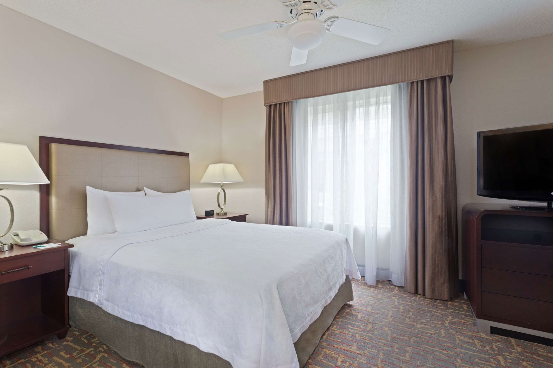 Premium bedding, desk, laptop workspace, iron/ironing board