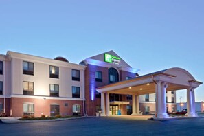 A hotel with a modern design, featuring a prominent 'Express' sign, a covered entrance, and a well-lit facade. - Holiday Inn Express Hotel & Suites Concordia by IHG (Concordia)