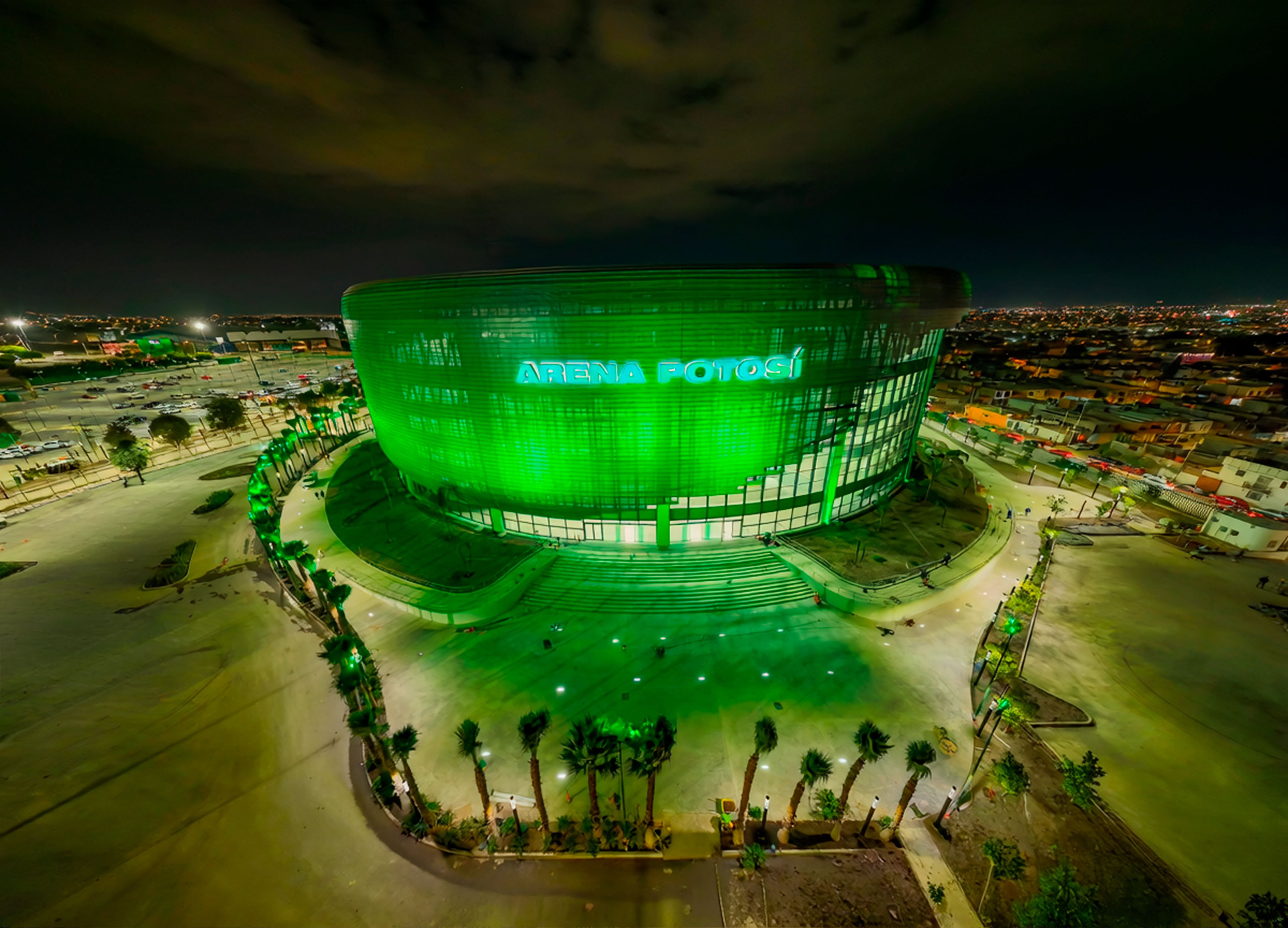 A stadium with a large, curved structure and a prominent entrance.