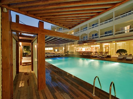 Outdoor pool, sun loungers. Athineon Hotel