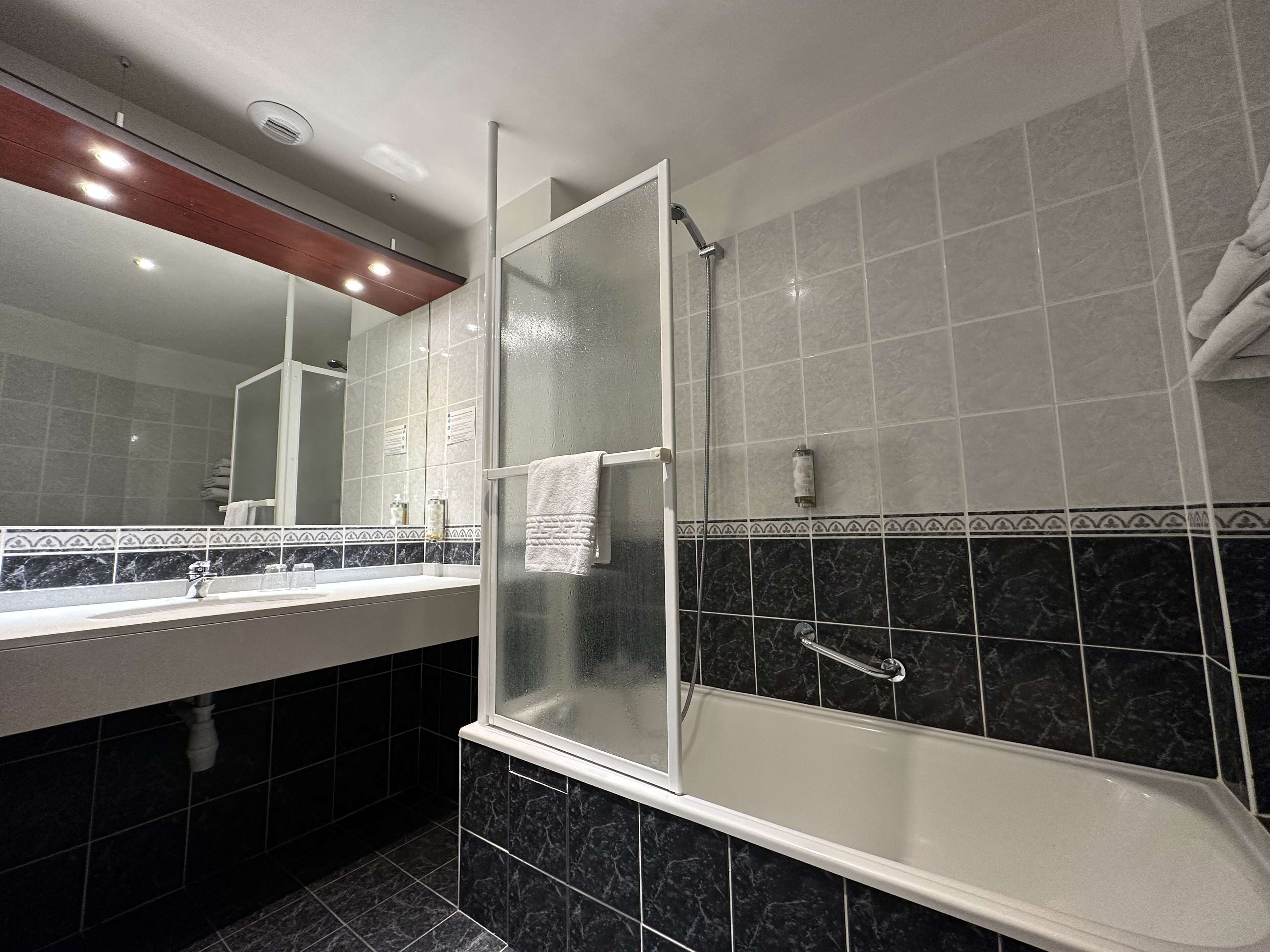 bathtub, hair dryer, towels