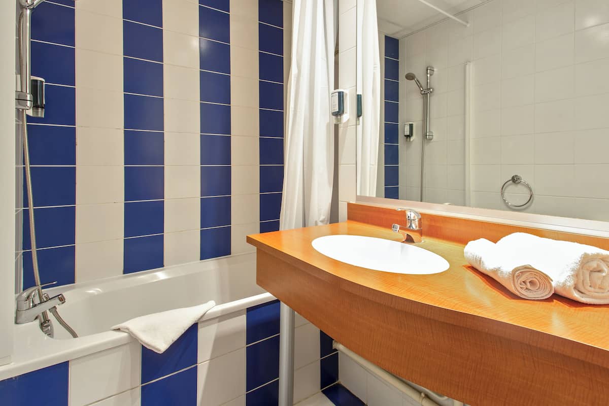 Eco-friendly toiletries, hair dryer, towels