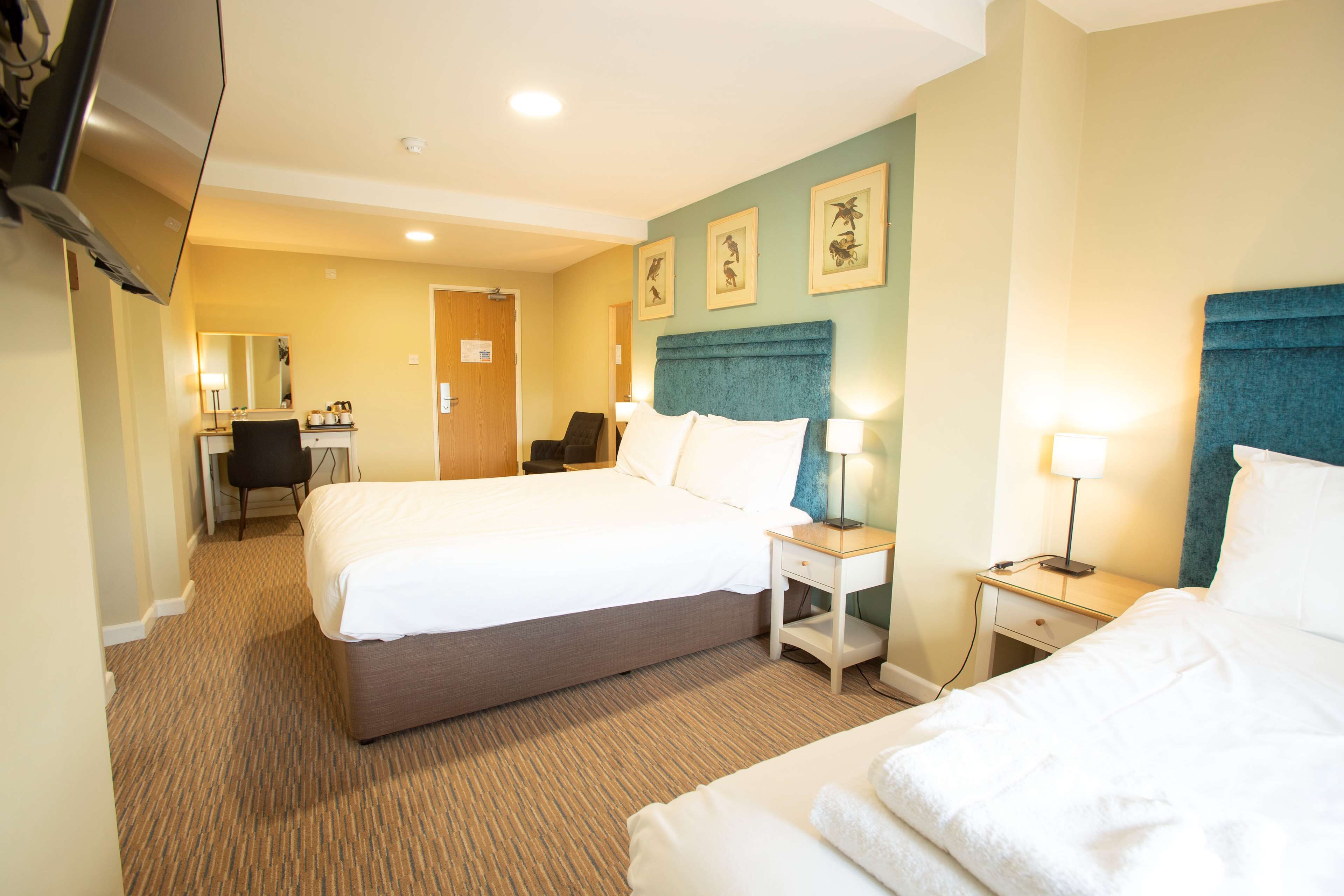 premium bedding, desk, blackout curtains, iron/ironing board