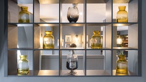 A display of glassware on shelves.