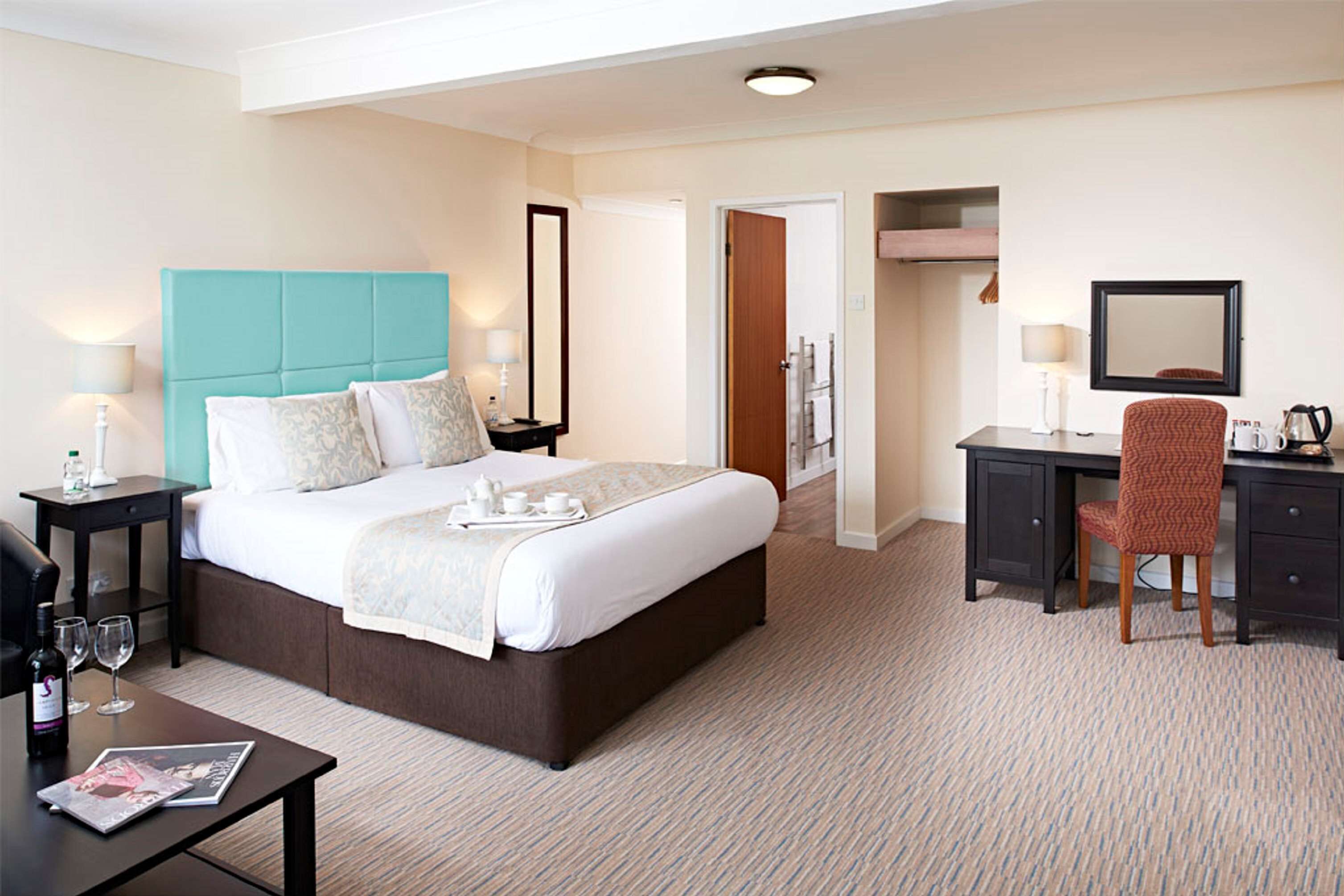 premium bedding, desk, blackout curtains, iron/ironing board