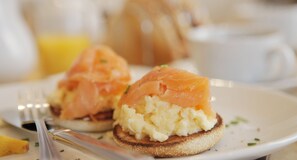 A breakfast plate with smoked salmon and scrambled eggs on toast. - Ashburton House (Scarborough)