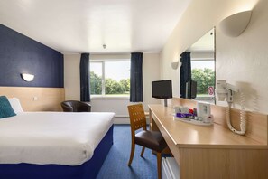 A hotel room with a bed, desk, chair, and a large window with curtains. - Ramada by Wyndham Chorley South (Chorley)