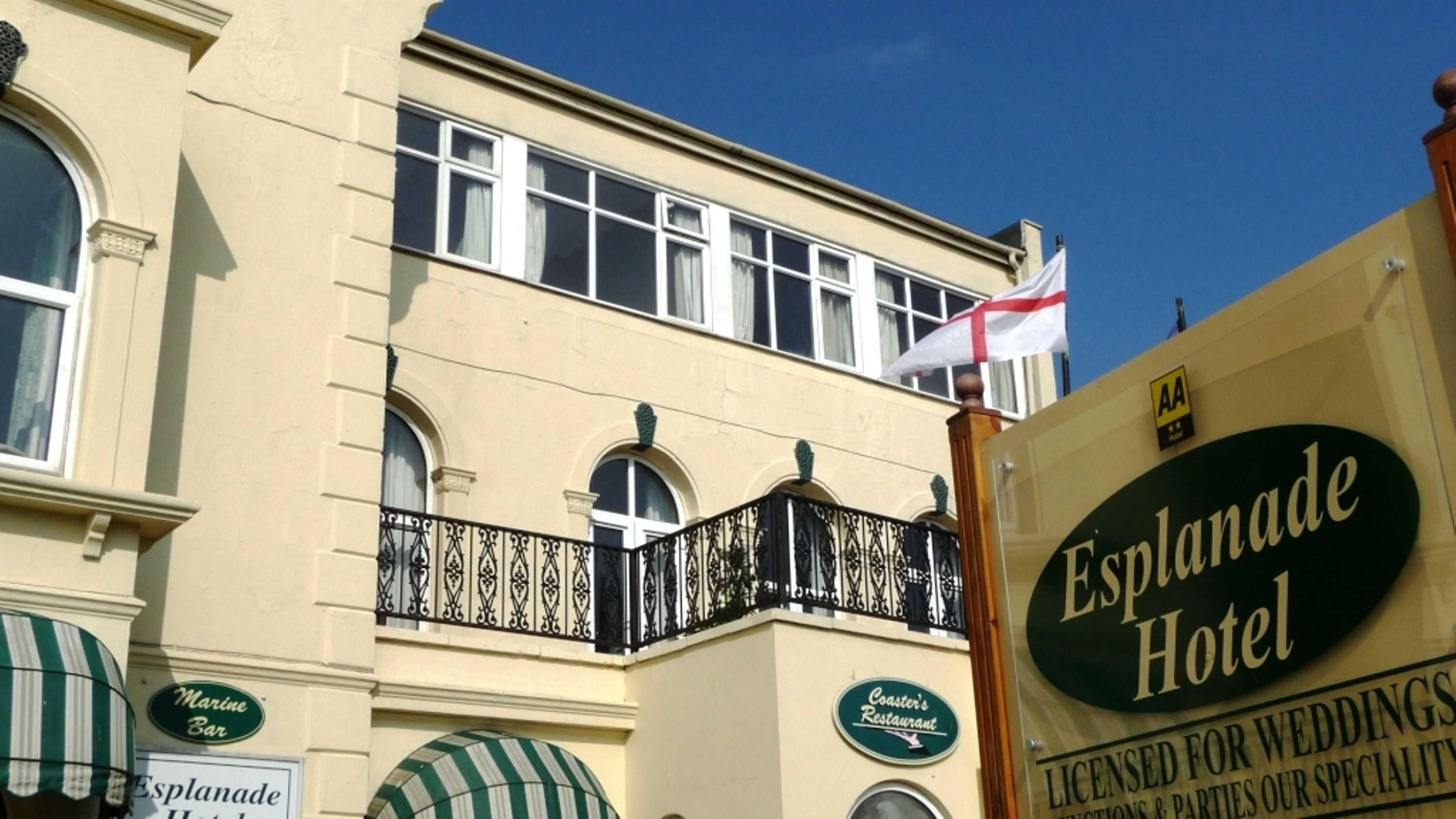 The Esplanade Hotel with a sign indicating it is licensed for weddings.