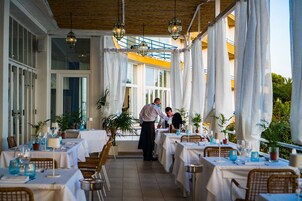 Lunch, dinner served; Italian cuisine, beach views 