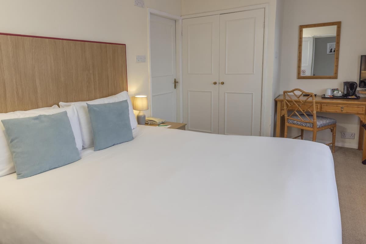 Premium bedding, desk, blackout drapes, iron/ironing board (on request)