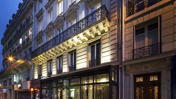 A historic building with ornate balconies and large windows. - Hotel Le Relais du Marais (Paris)