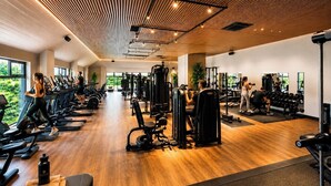 A gym with treadmills, weight machines, and a wooden ceiling. - The Wiltshire Hotel, Golf and Leisure Resort (Swindon)