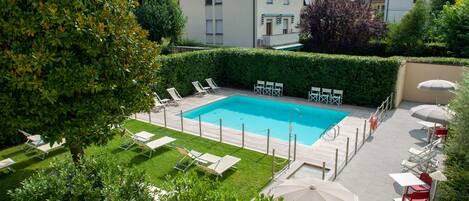 Seasonal outdoor pool, open 9:00 AM to 8 PM, pool umbrellas