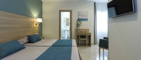 Desk, blackout curtains, rollaway beds, free WiFi