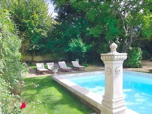Seasonal outdoor pool, open 9:00 AM to 8:00 PM, pool umbrellas